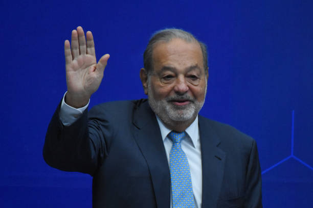 Carlos Slim Helu with hands lifted